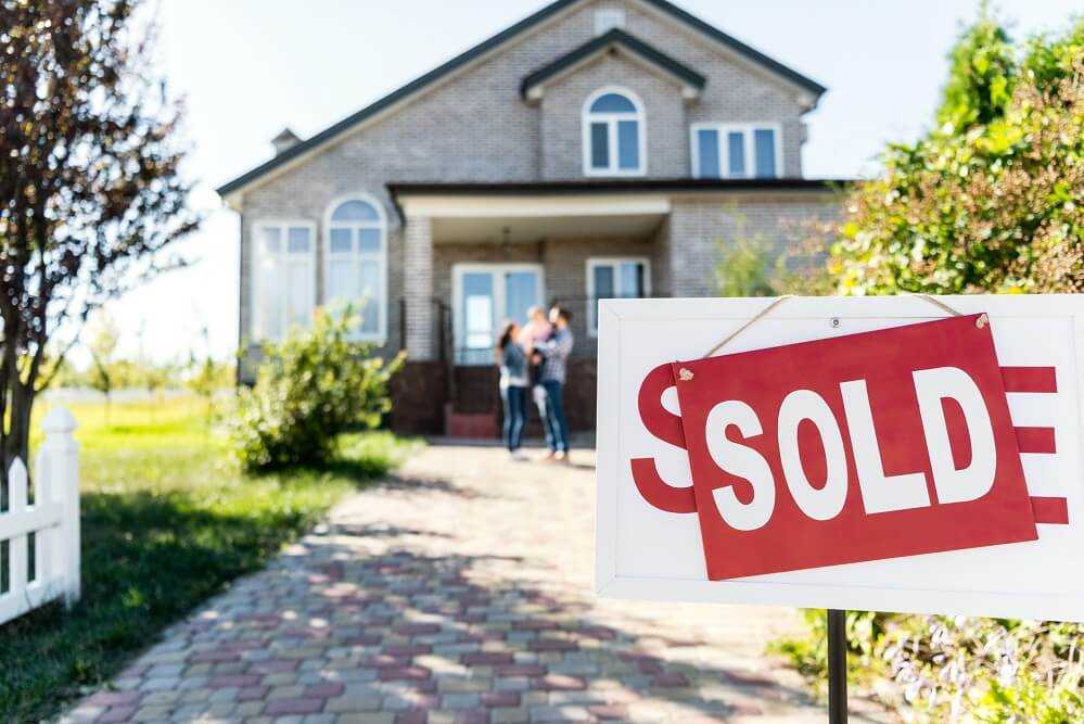 Sold sign in front of a home.