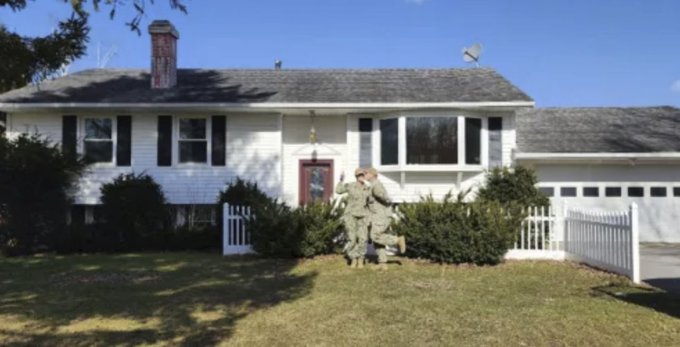 picture of Michele M. in front of a house