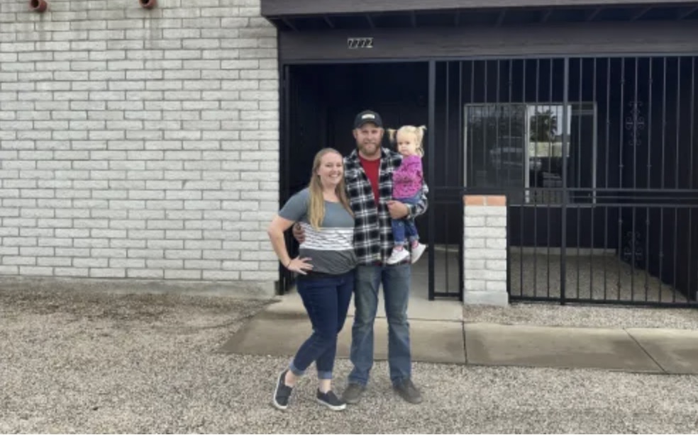 picture of Brad S. in front of a house