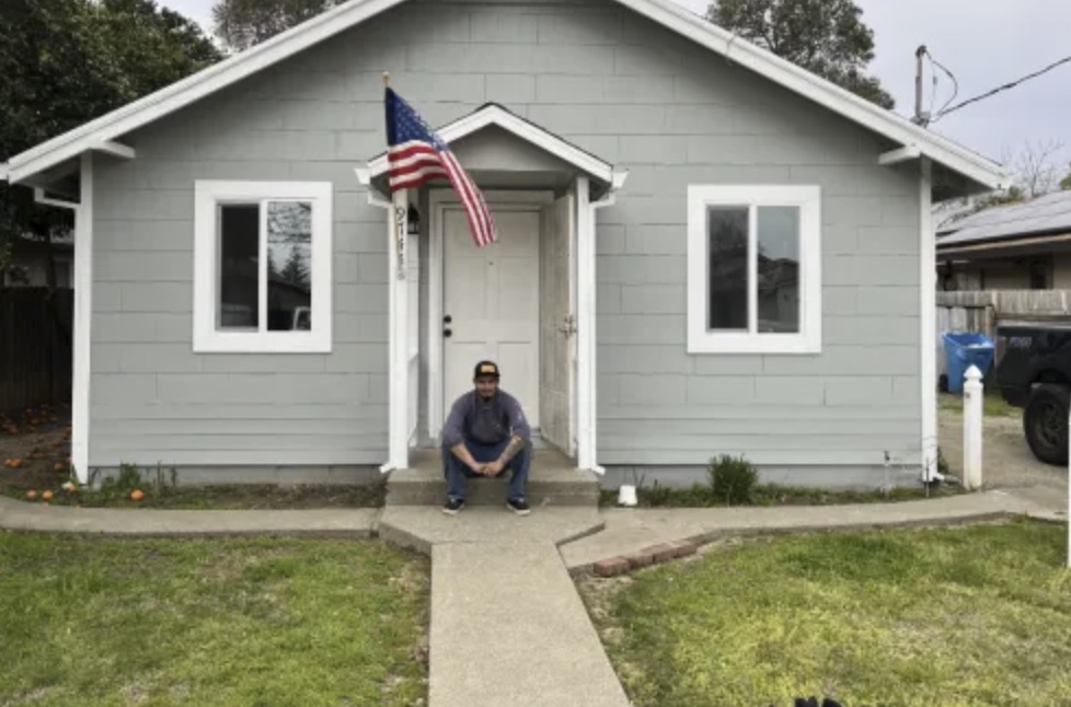 picture of Sean J. in front of a house