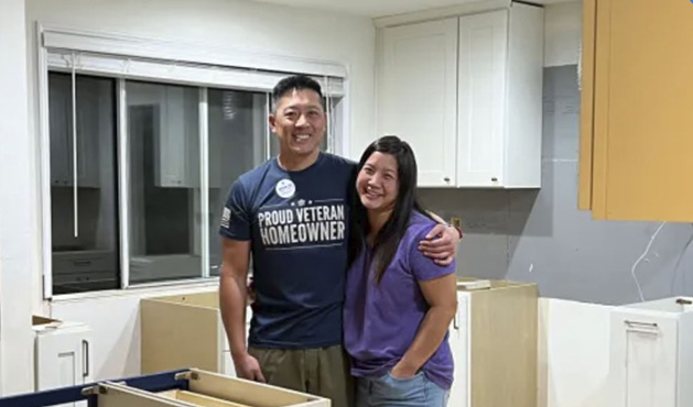 picture of Jeremy L. in front of a house